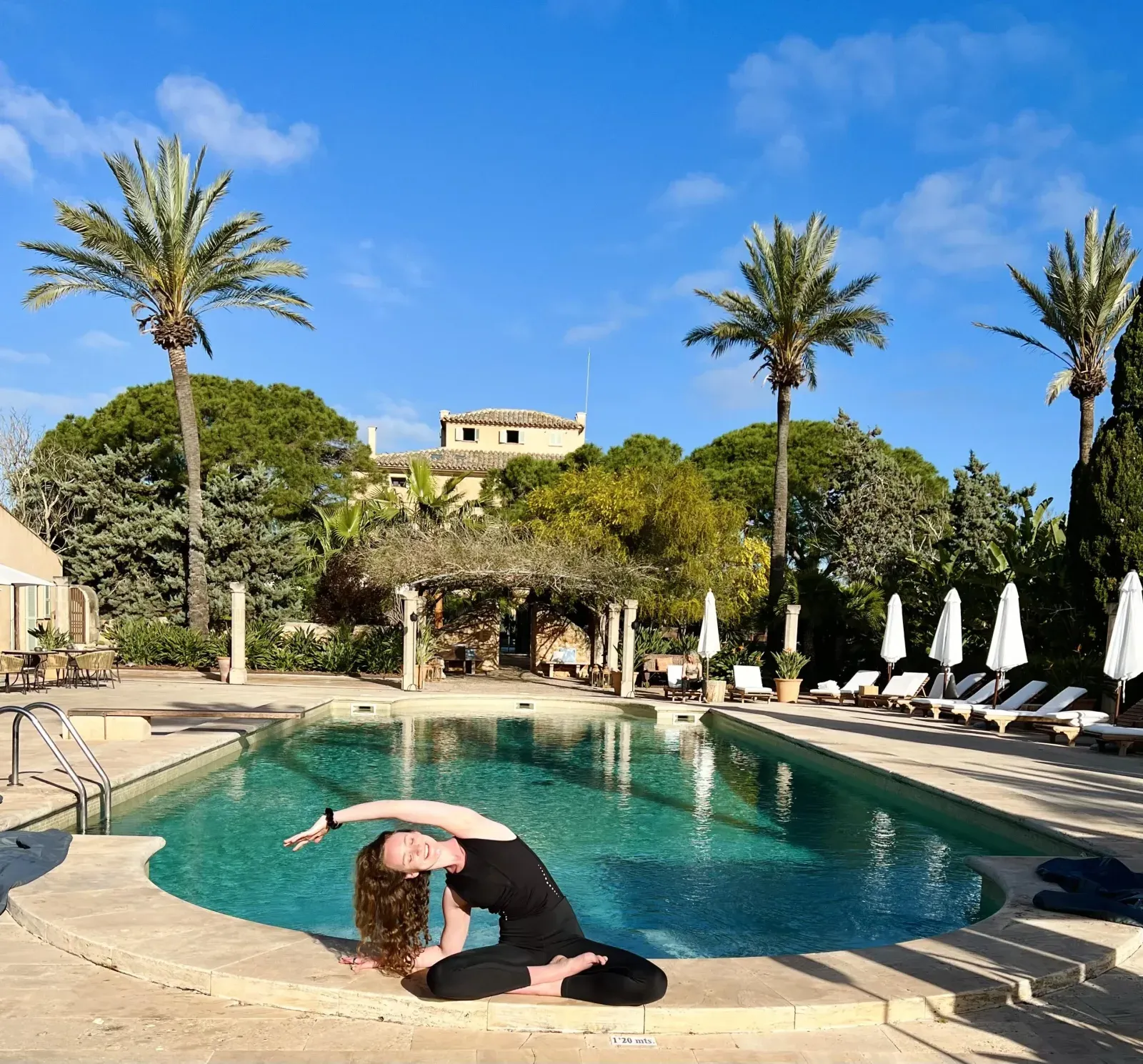 Julia doing yoga near a pool – Sunshine Yoga